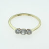 gold three stone diamond ring