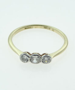 gold three stone diamond ring