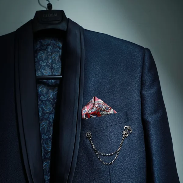 Vintage bar brooch laid on fabric, close-up