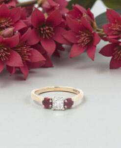 9ct Yellow Gold Diamond .25ct and Ruby Trilogy Ring surrounded by flowers